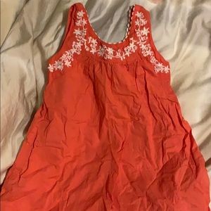 Coral colored dress with embroidered detail